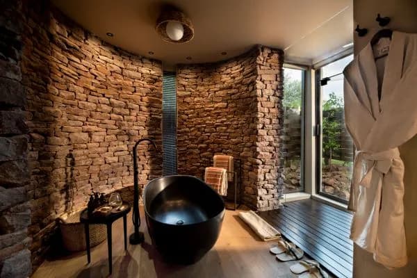 En-suite bathroom with bath and shower