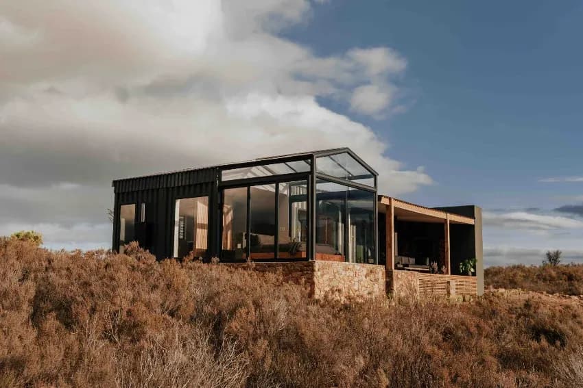 Wood-fired hot tub at Copia Eco Cabins with hilltop views